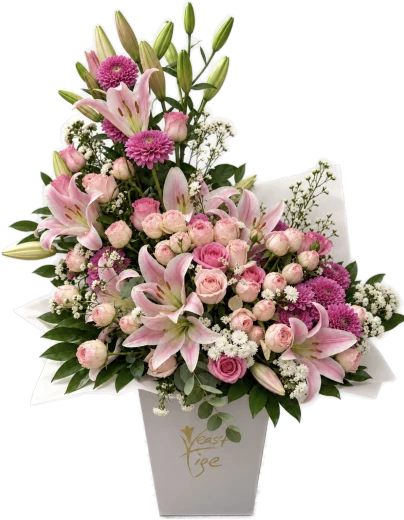 Pink lilies, pink roses and white gypsophila in a white Vert Tige vase